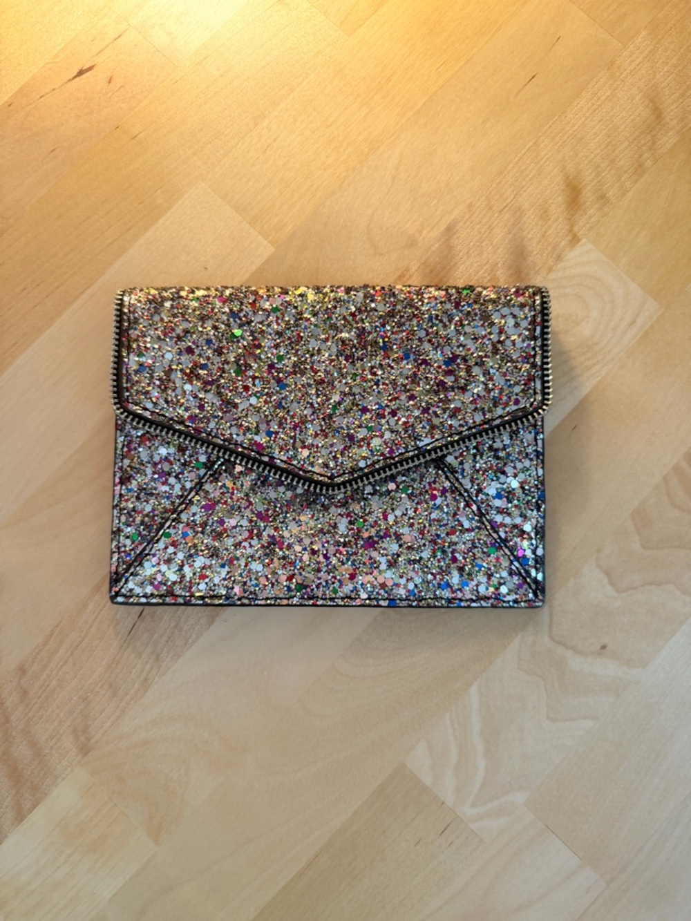 Rebecca Minkoff Leo Envelope Clutch in a multicolor glitter finish
